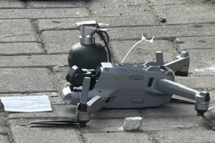 Evidence of a drone dropping an object resembling a grenade accompanied by a threatening message at the house belonging to Novianus Martin Bau, in Pamulang, South Tangerang.